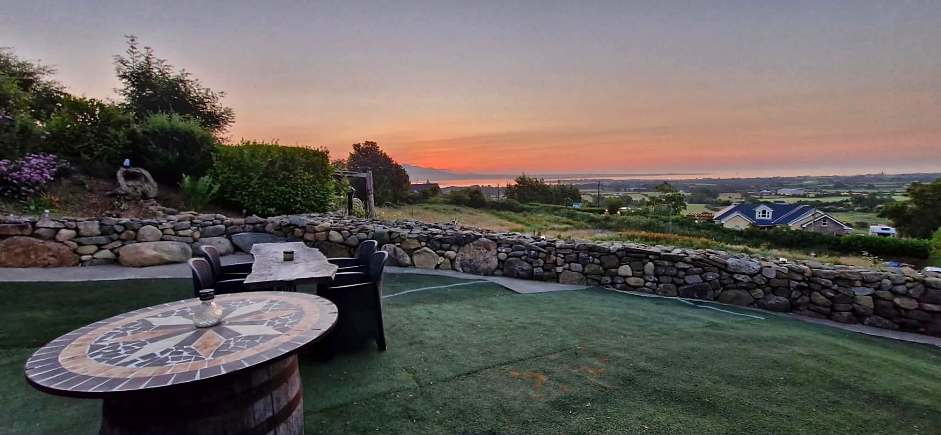 Sunrise over Carlingford Lough from the terrace beside Fairy Cove at Rosemount Glamping
