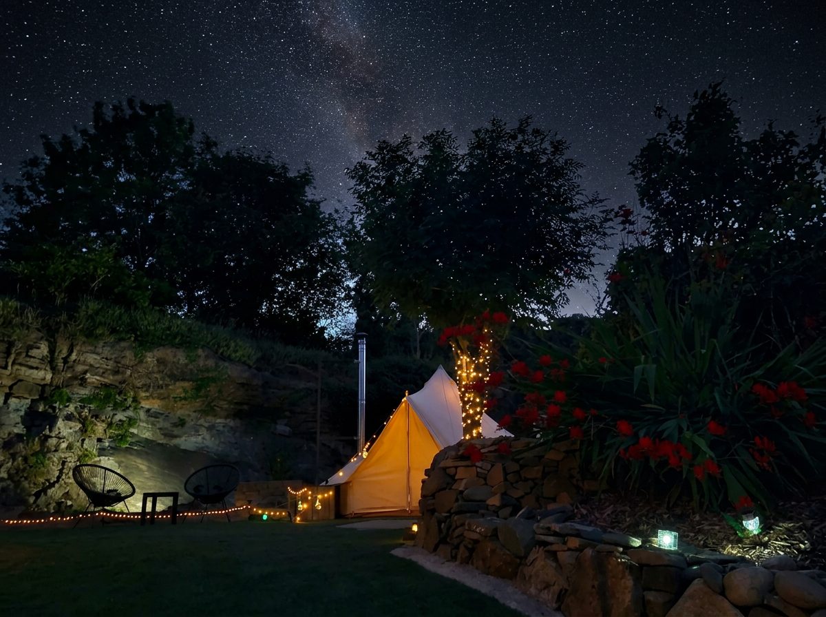 A star-filled night sky above a glowing bell tent at Rosemount Glamping